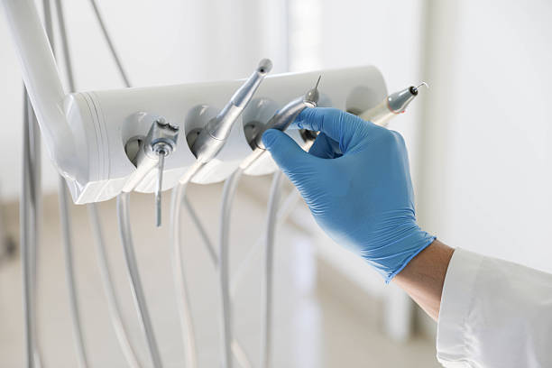 Professional Tooth Extraction technician working in Campbell, OH
